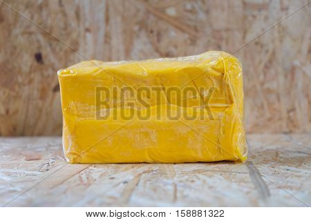 wrapped fresh butter sticks on wood table