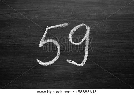 number fifty nine enumeration written with a chalk on the blackboard