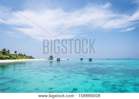Panorama of tropical lagoon on the island in Indian Ocean. Maldives.