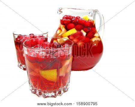 fruit cruchon cocktail punch in jug and glasses with ice and fruit