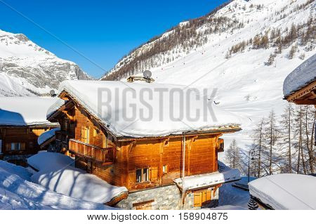 Alpine winter mountain landscape. French Alps covered with snow in sunny day. Val-d'Isere, France