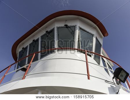 Portland Maine USA - August 9 2009: Brightly painted ferry wheelhouse towers over bow of vessel