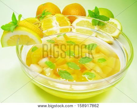 fruit cruchon cocktail punch in bowl with ice and fruit