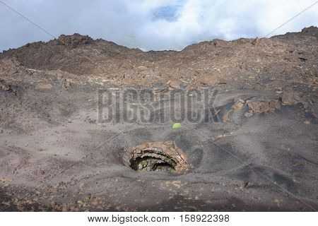 Grotta del Gelo (Cave Ice) and green tent in Etna Park, Sicily