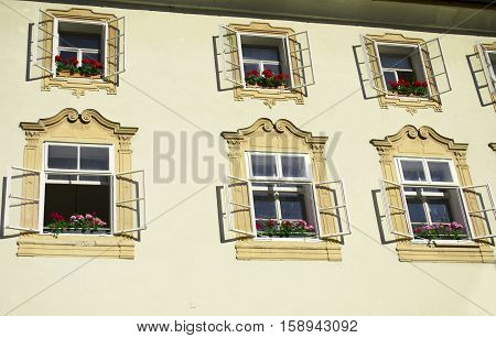 Open windows with white frames and yellow trim
