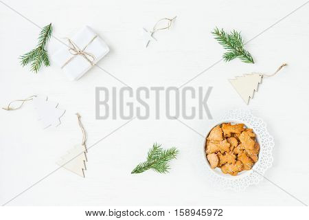 Christmas workspace. Gift fir branches christmas cookies. Flat lay top view
