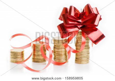 gold coins with a red gift bow. Concept of pecuniary profit.