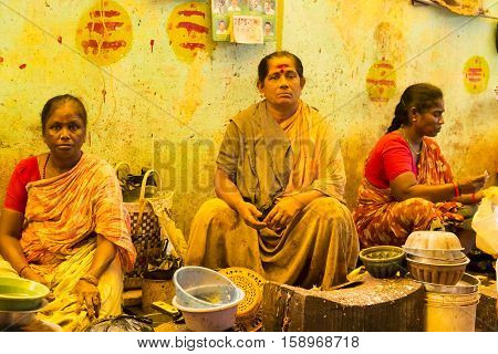Illustrative image. Pondicherry, Tamil Nadu, India. February 26, 2014. Market place with a lot of shops of fishs and people buying, selling varieted fishs by women.
