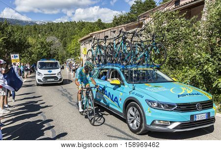 Mont Ventoux France - July 142016: The Italian cyclist Diego Rosa of Team Astanadiscussing with the team staff while riding on the road to Mont Ventoux during the stage 12 of Tour de France 2016.