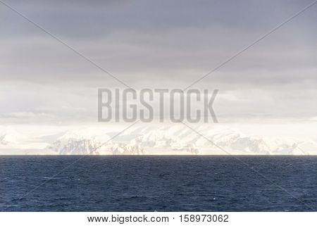 Antarctica in a cloudy day- Antarctic Peninsula - Palmer Archipelago - Neumayer Channel - Global warming - Fairytale landscape