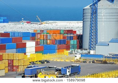 Cargo Container, Pipe And Grain Drayer In Port