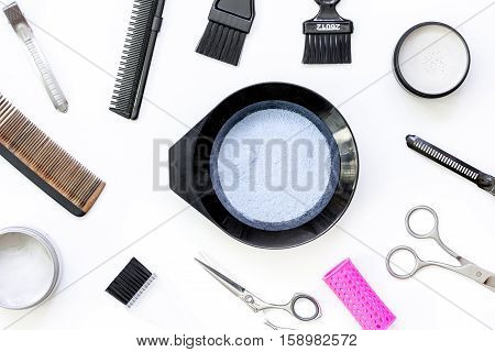 Tools for hair dye and hairdye top view on white background
