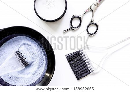 Tools for hair dye and hairdye top view on white background