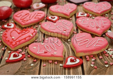 Festive cookies decorated with pink sugar mastic