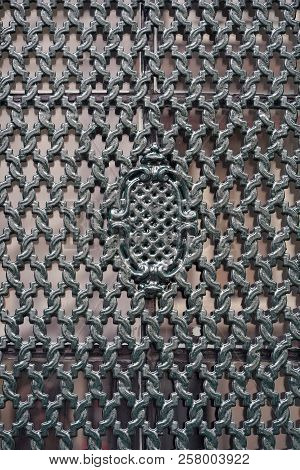 Piece Of Wrought Iron Grating On Window. Vintage Metal Openwork Grille In Green, Abstract Background