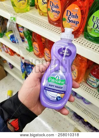 Plattsburgh, Usa - September 10, 2018: A Man Holding A Palmolive Cleaning Agent. Is A Cleaning Produ