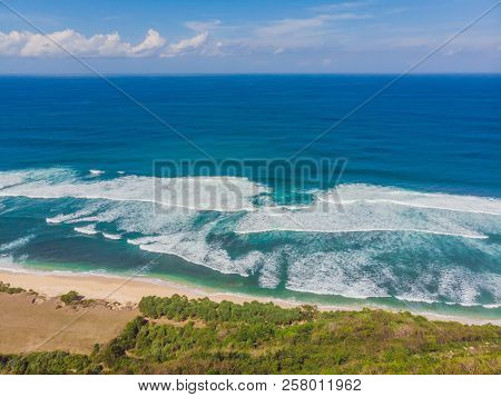 Top Aerial View Of Beauty Bali Beach. Empty Paradise Beach, Blue Sea Waves In Bali Island, Indonesia