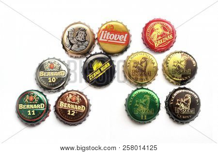 HRONOV, CZECH REPUBLIC - June 4, 2018: Beer caps collection on white background. Czech traditional brewaries: Kozel, Bernard, Gambrinus, Cerna Hora, Breznak, Litovel.