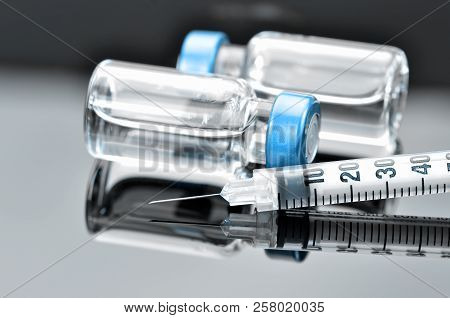 Tuberculin Syringe And Sterile Vial Filled With Medication Solution. An Injection Pharmaceutical Dos