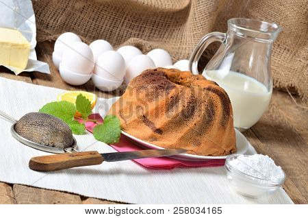 Homemade Lemon Bundt Cake With Lemon, Melissa, Milk, Eggs And Tea