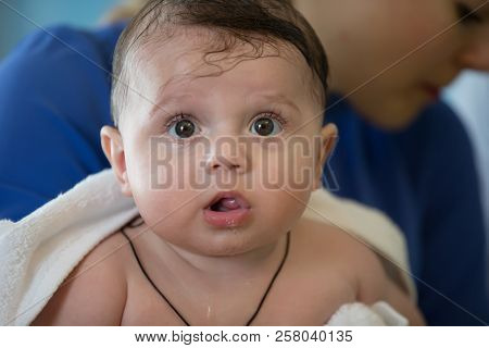 Face Of Baby With Ogive Eyes.babe In A Towel