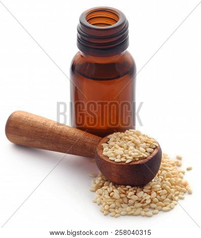 Peeled Sesame Seeds With Oil In A Amber Bottle