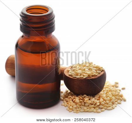 Peeled Sesame Seeds With Oil In A Amber Bottle