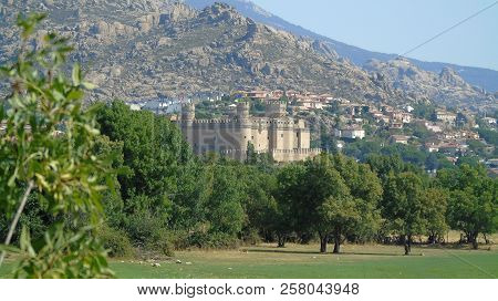 Castle Manzanares El Real In The Background Behind Some Trees