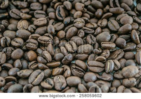 Roasted Coffee Beans Close-up, Can Be Used As A Background.