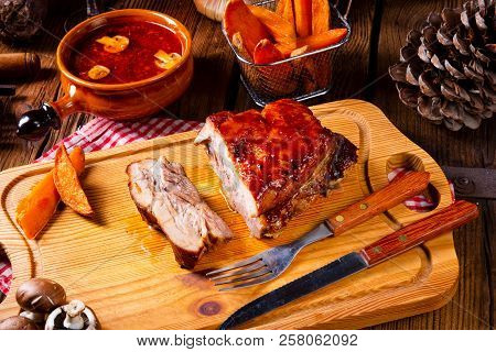 Spicy Roasted Meat With Mushroom Sauce In The Oven