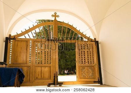 Cheia, Romania - August 15, 2018: Beautiful Wood Doors At The Entrance Gate Of Cheia Monastery In Ch