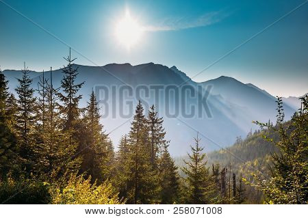Tatra National Park, Poland. Sunrise Above Summer Mountain And Misty Forest Landscape. Morning Sun S