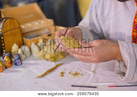 Potter Making Clay Figure For Board Game