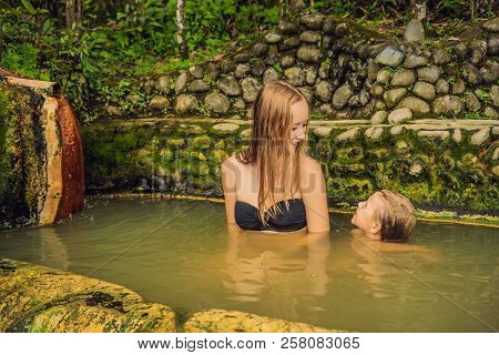 Mom And Son Travelers In Belulang Hot Springs In Bali, Village Mengesta, Penebel District, Tabanan R