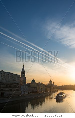 Scarlet Glow Of The Sunset Over The Moscow River With Boat