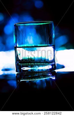Colored Lighting Of Glasses In The Night Club Bar