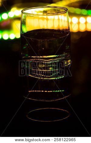 Colored Lighting Of Glasses In The Night Club Bar