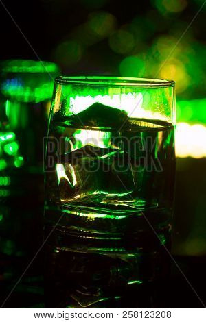 Colored Lighting Of Glasses In The Night Club Bar