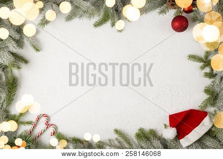 Table Top Shot Of A Frame Made Of Fir Branches, Decorated With Candy Cane, Christmas Tree Balls, San