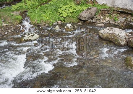 Beautiful Place At Source Of The River In The Mountains Of Southern Caucasus. Mountain River In Reso