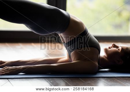 Young Sporty Woman Doing Dvi Pada Pithasana Exercise, Close Up