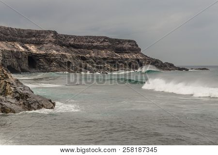 Beach with waves in Puertito de Los Molinos, Fuerteventura, Canary Islands, Spain.