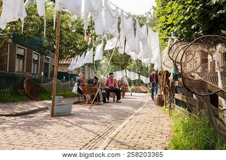 Enkhuizen, Netherlands - August 19, 2015 - The Inhabitants In The Traditional Clothes In Dutch Fishe