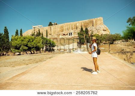 Girl Goes On A Tour Of The Ancient Acropolis In Greece