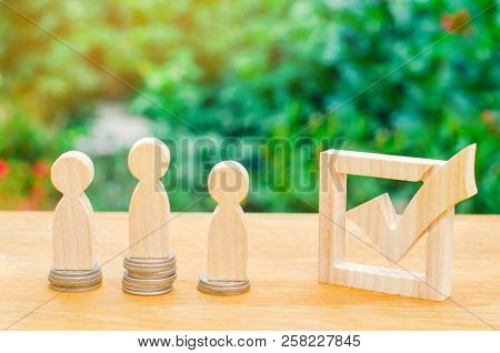 Wooden Figures Of People And Checkbox. Promotion Of Interests And Lobbying, Adoption Of Laws. Corrup