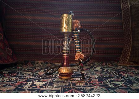 Hookah Hot Coals On Shisha Bowl Making Clouds Of Steam At Arabian Interior. Oriental Ornament On The