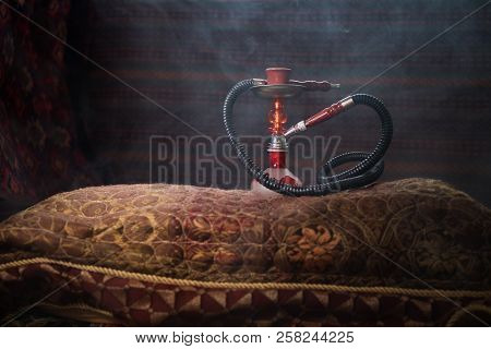 Hookah Hot Coals On Shisha Bowl Making Clouds Of Steam At Arabian Interior. Oriental Ornament On The