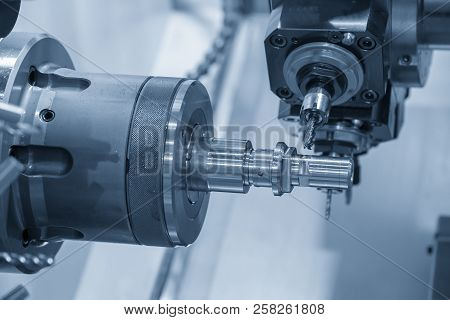 The Cnc Lathe Machine Cutting  The Groove Slot At The Steel Shaft By Milling Spindle .hi-technology 