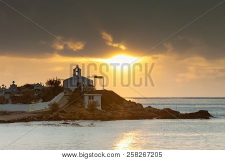 Agios Fokas Near Monemvasia In Stormy Weather Overcast Sky, Sunrise. Small Cemetery On Sea Shore, Ma