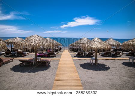 Permissa black sand beach in Santorini. Greece. 